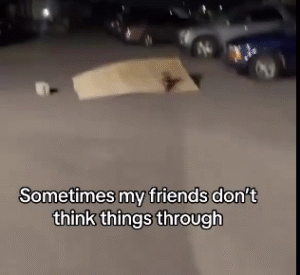 The video showcases a small remote-controlled dirt bike launching off a makeshift ramp in the night.